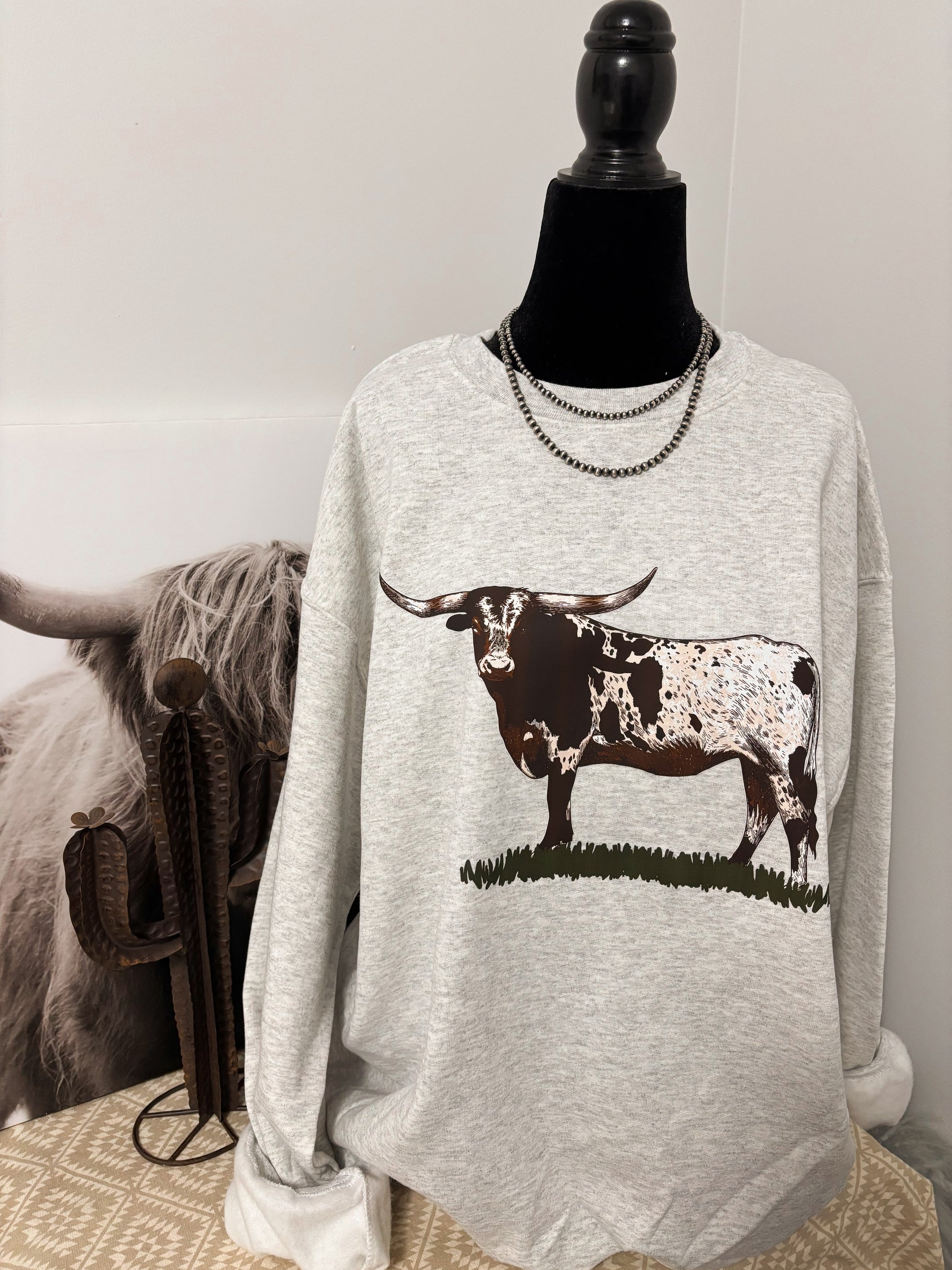 Close-up of Ranch King Crewneck design – longhorn cattle print on soft fleece for everyday western wear