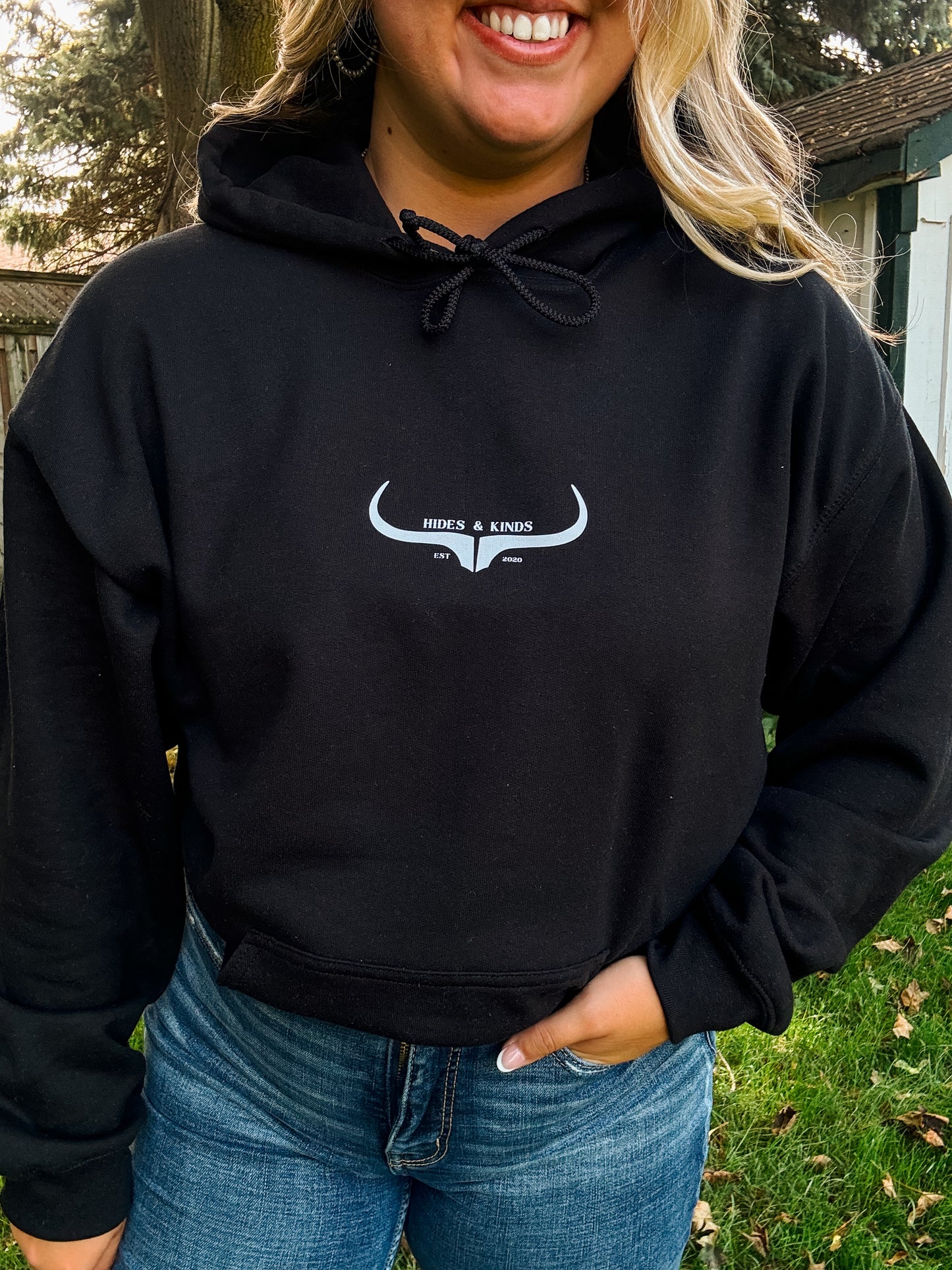 Front view of the Hides and Kinds black hoodie featuring a clean western logo design with horns and text