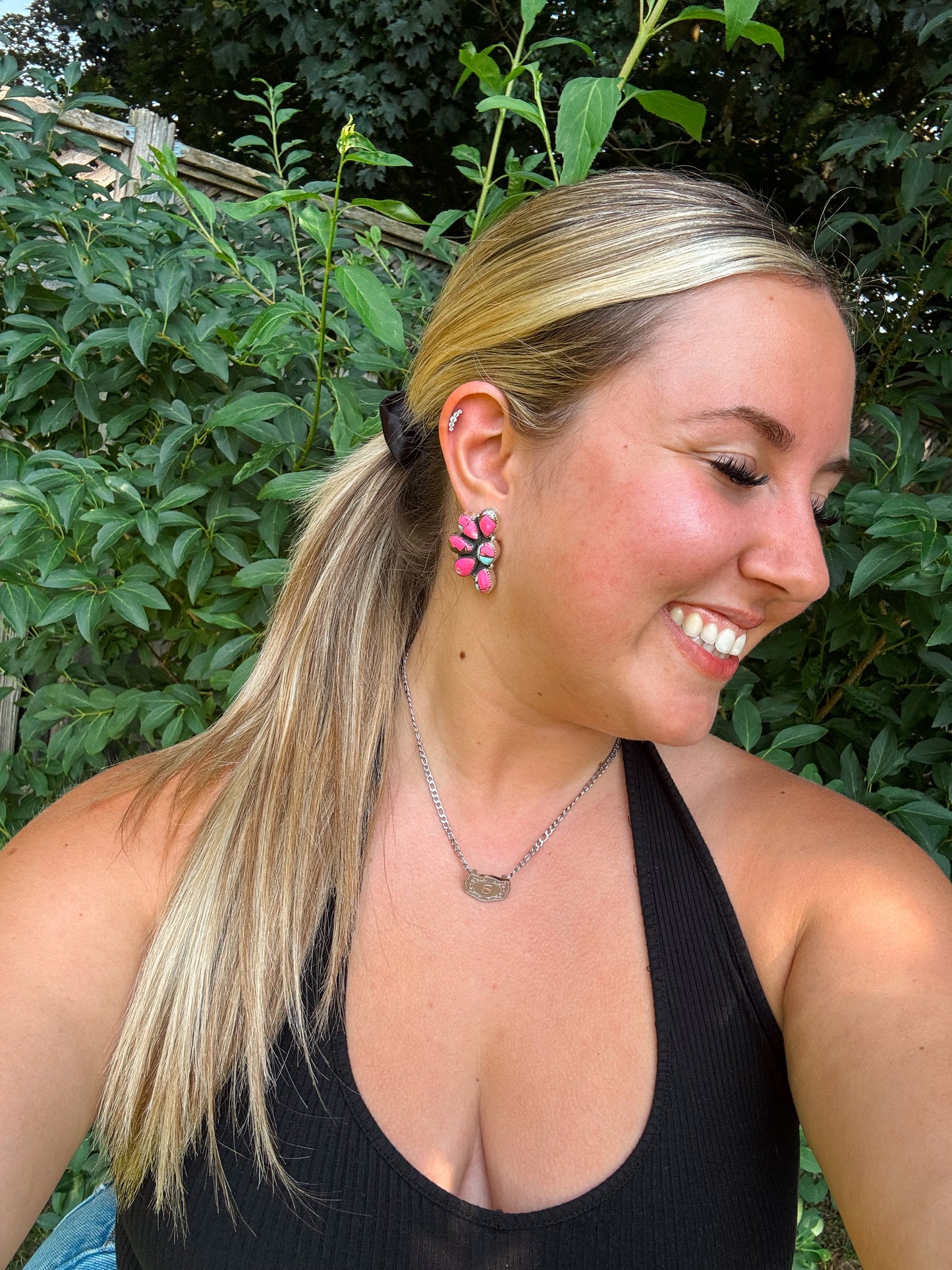 Cotton Candy Cluster Stud Earrings styled outdoors with greenery background