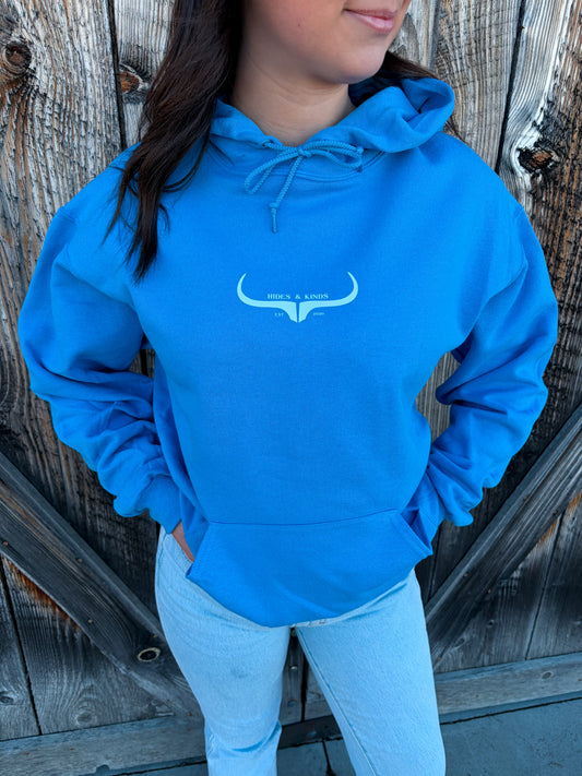 Bright blue western hoodie with longhorn logo by Hides and Kinds