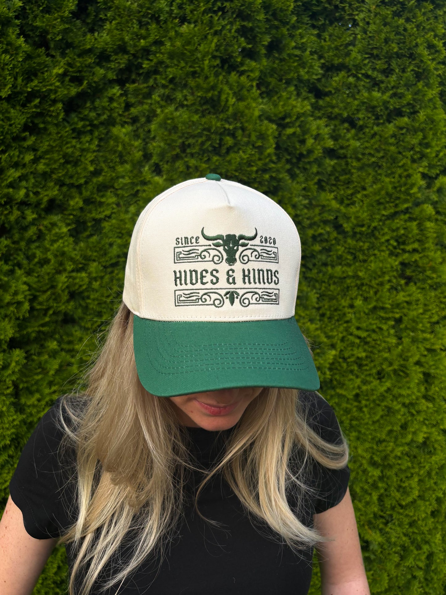 Close-up shot of The Ranchline Hat front design with green brim and cream crown.