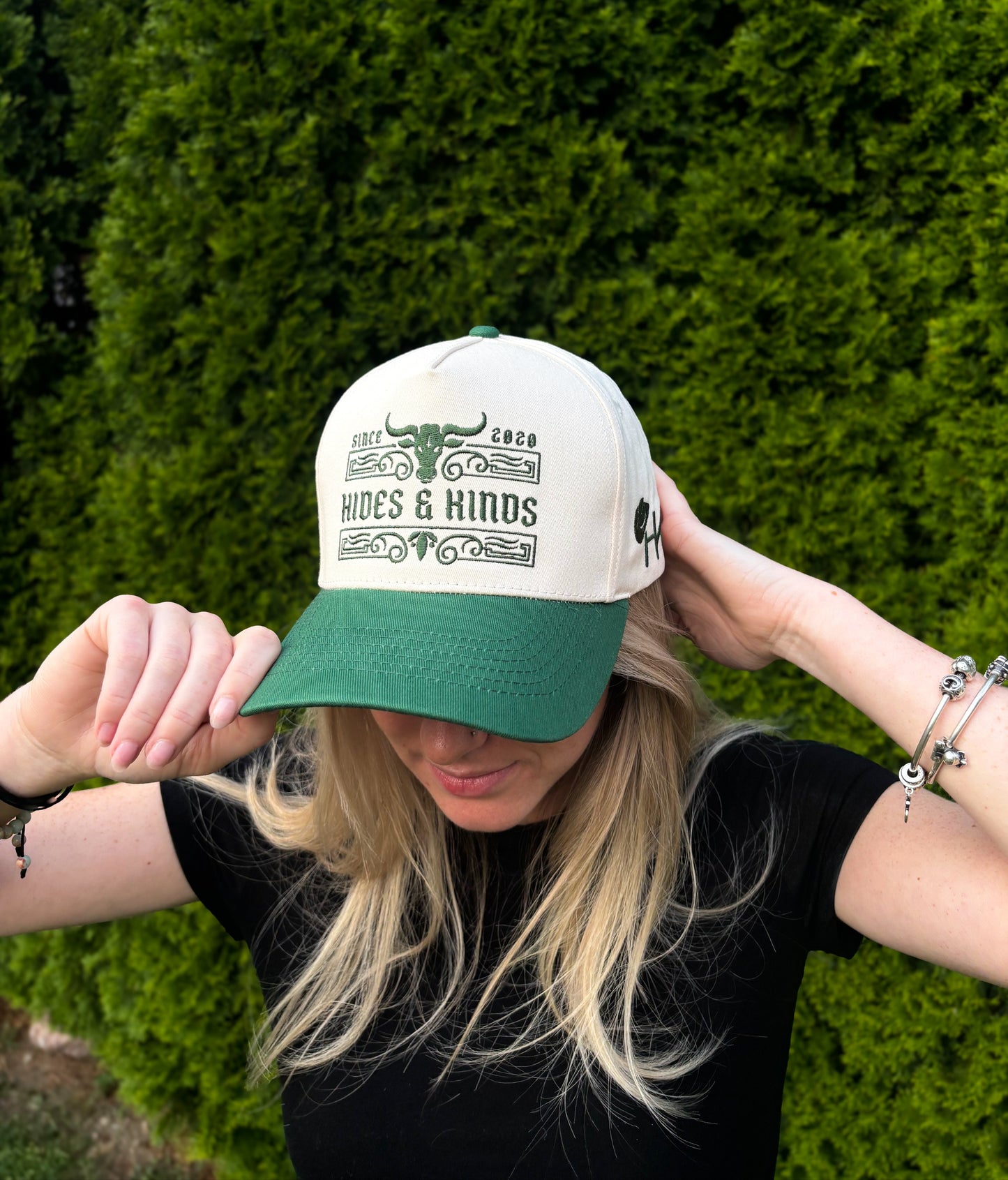 Woman wearing The Ranchline Hat facing forward, showing full Hides & Kinds front design.