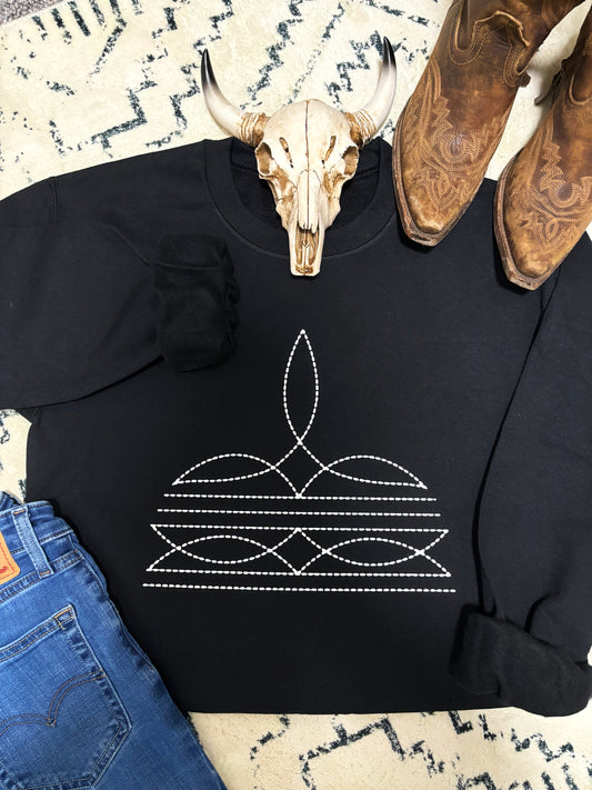 Black crewneck with detailed boot stitch graphic, styled for a bold western look