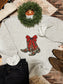 Cowgirl Christmas crewneck with festive cowboy boots graphic and red bow, styled with jeans and boots