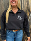 Close up of a woman wearing the Hides & Kinds black brand quarter zip with white logo design