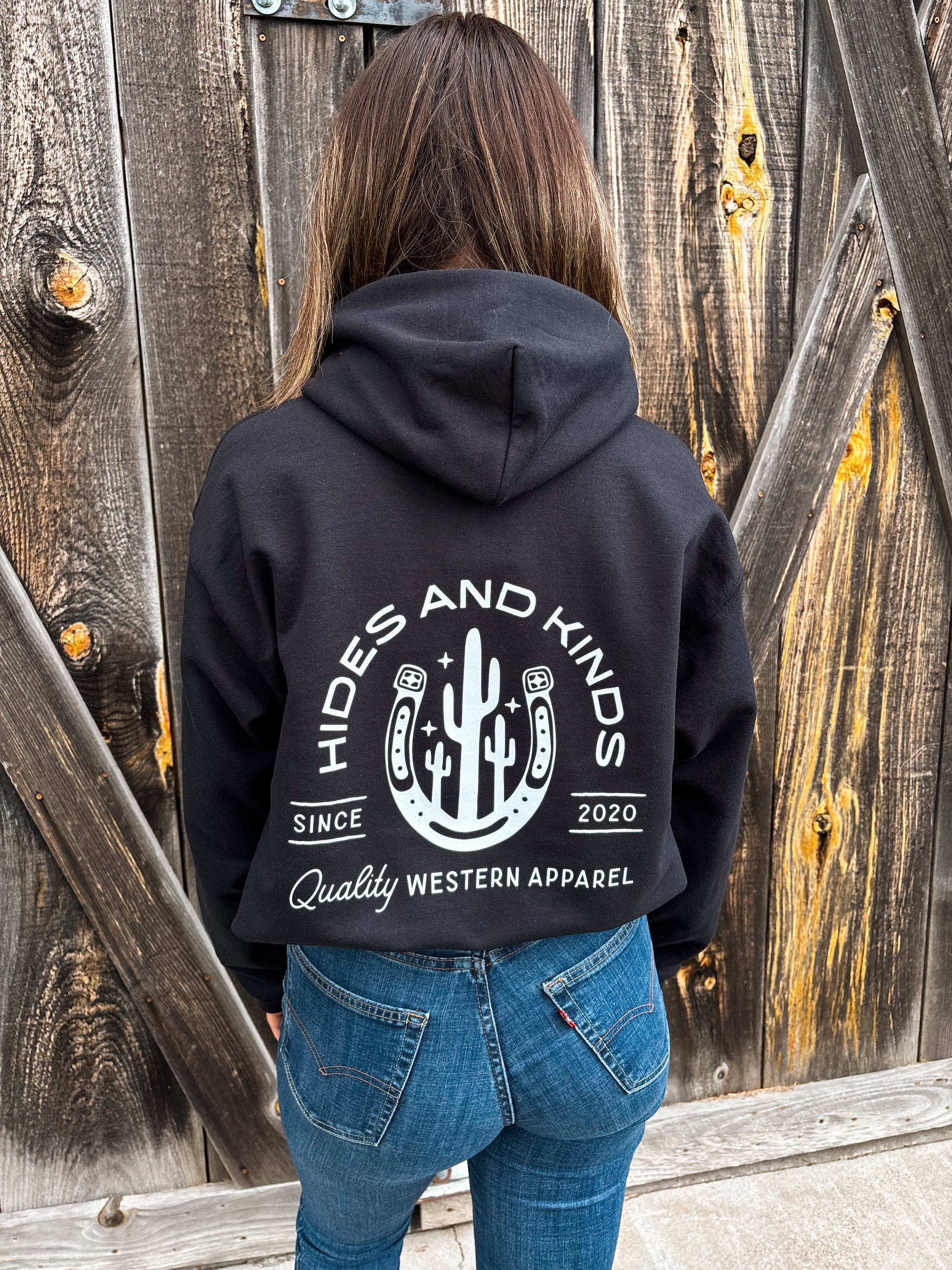 Back view of the H&K Branded Horseshoe Hoodie in black with cactus horseshoe graphic