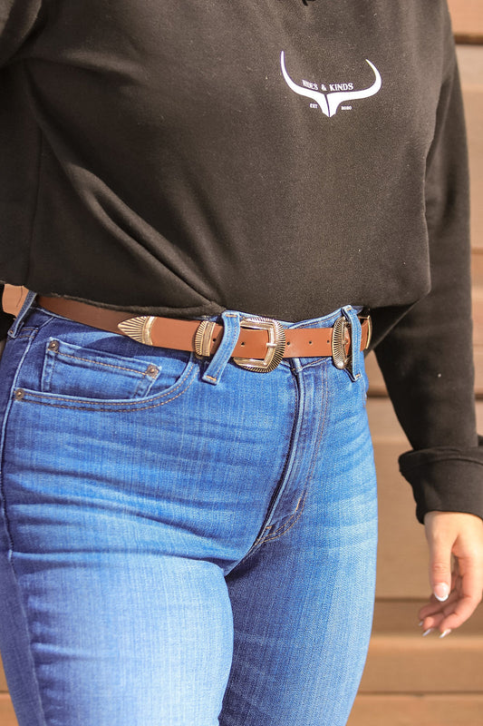 Brown western belt with double silver buckles, front view