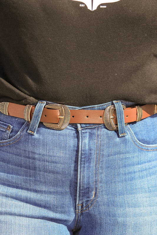 Side view of brown leather double buckle western belt