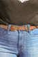 Side view of brown leather double buckle western belt
