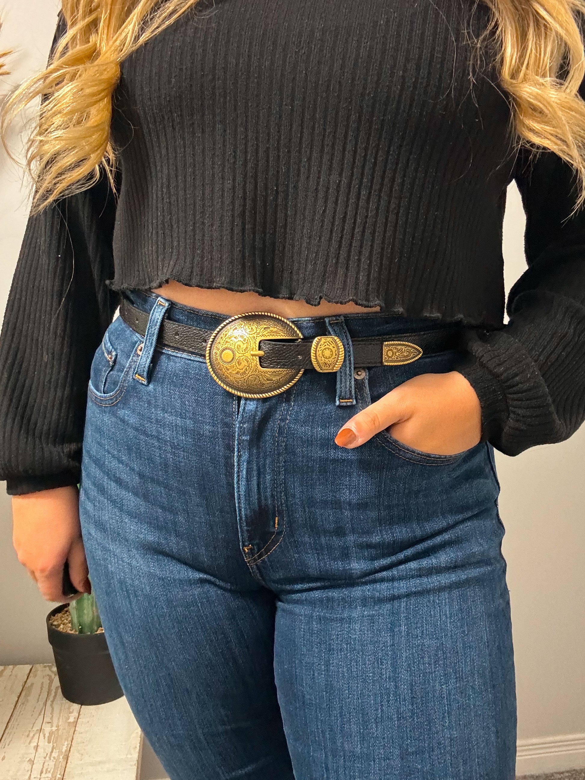 Side angle of Lone Star black belt with engraved gold buckle