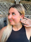 Woman holding hair back to show turquoise Stone Row Studs featuring triple turquoise stones