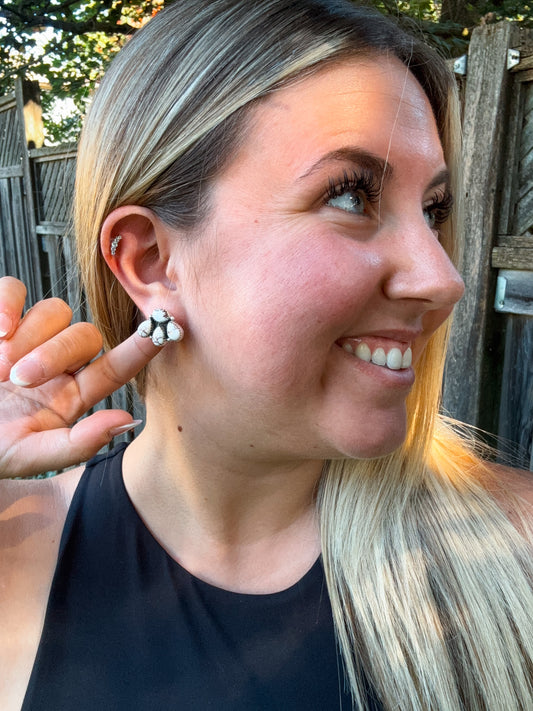Side profile of model showcasing Wild Ridge Stud Earrings with bold howlite stones in a floral cluster design.
