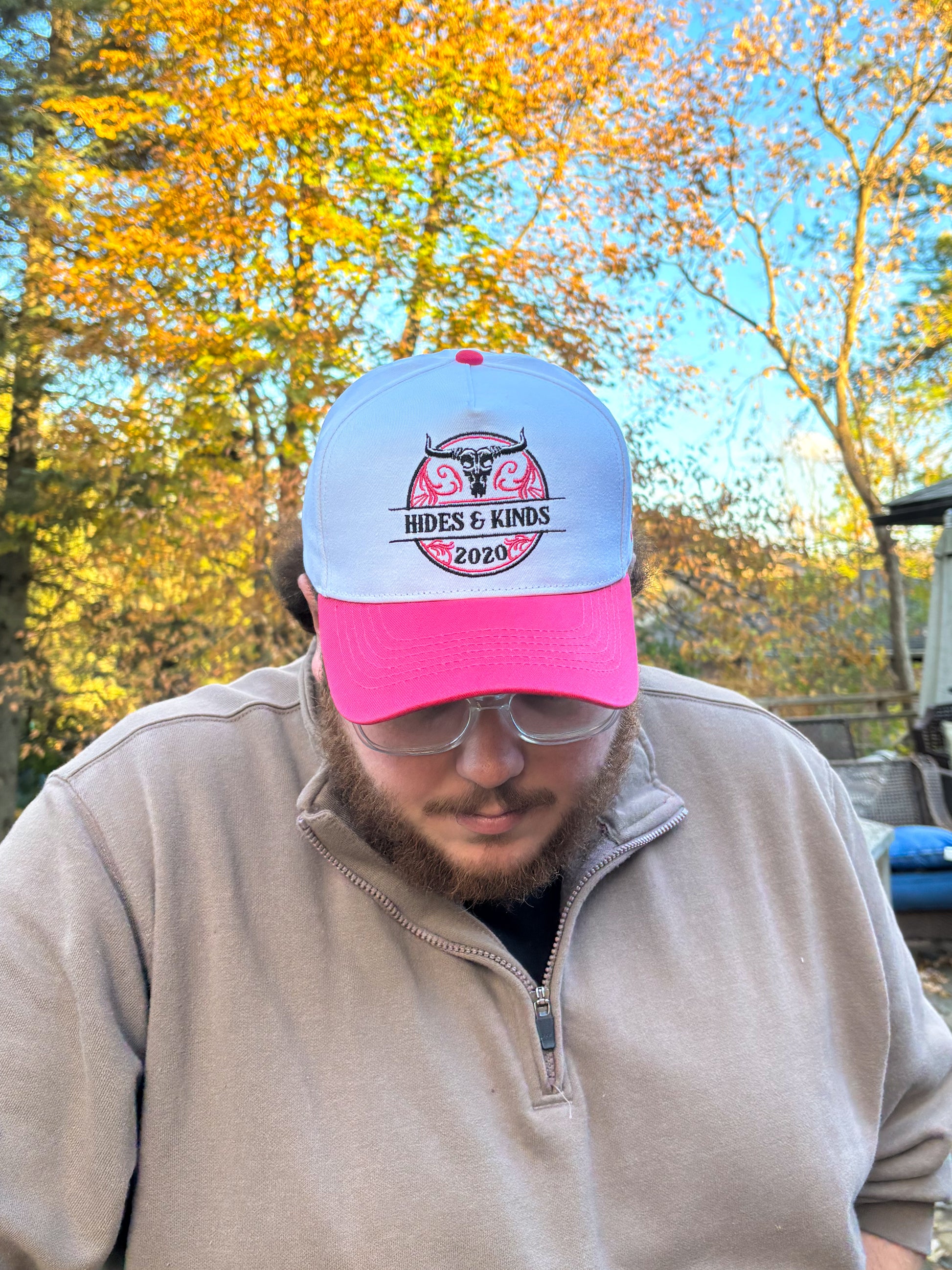 Back view of The Stampede Snapback in pink and white with Wild N Free text embroidered above snapback closure.