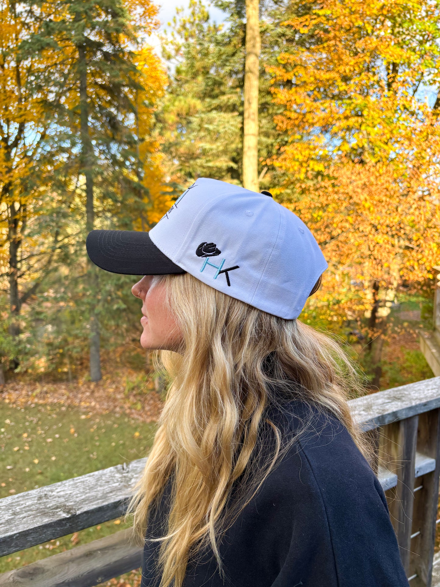 Angled front view of teal and black Hides & Kinds Stampede Snapback showcasing the western bull skull patch.