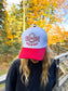 Front view of Hides & Kinds Wild N Free Hat in red and white with embroidered horseshoe logo and Wild N Free text.