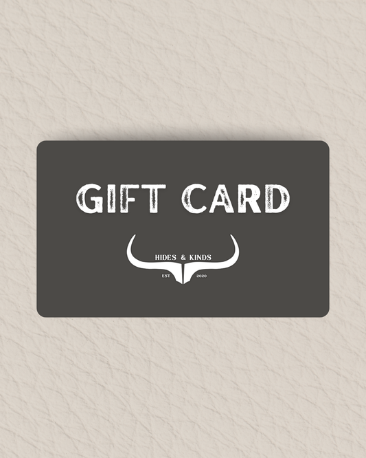 Gift card with 'Hides & Kinds' logo on a textured beige background