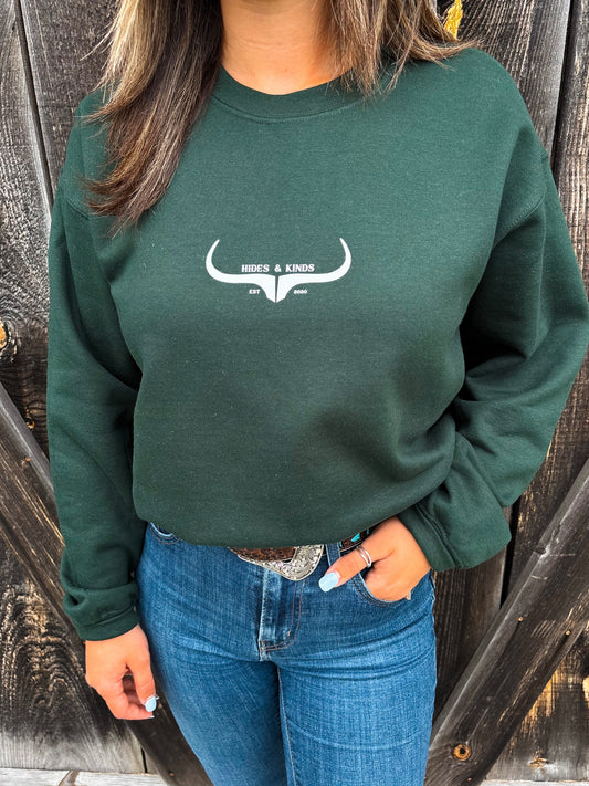 Hides & Kinds forest green crewneck with original longhorn logo close-up
