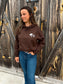 Western style Outrider Hoodie in chocolate brown with front and back logos, styled with denim