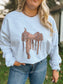 Close up front view of the Saddle Up Crewneck featuring an intricately drawn Western saddle graphic on a heather grey sweatshirt.