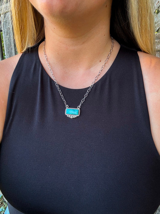Close up of the Stillwater Bar Necklace with turquoise stone on silver chain