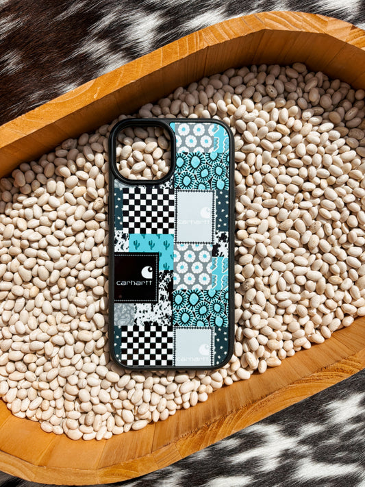 Western turquoise Carhartt phone case with a checkerboard pattern, photographed on a cow print blanket and bed of white beans