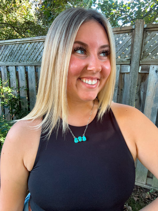 Model wearing the Turquoise Wildstone Necklace styled with a black tank top and natural lighting.