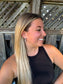 Model smiling while wearing the White Canyon Dangle Earrings, styled with a black tank and straight blonde hair.