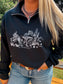 Detailed view of the western horse graphic on the Wild Horse Quarter Zip, styled with silver jewelry and jeans.
