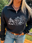 Close up of the black Wild Horse Quarter Zip with western desert horse graphic, styled with turquoise necklace and denim.