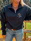 Western quarter zip in black with HK tooled logo detail – casual fit shown styled with turquoise jewelry.