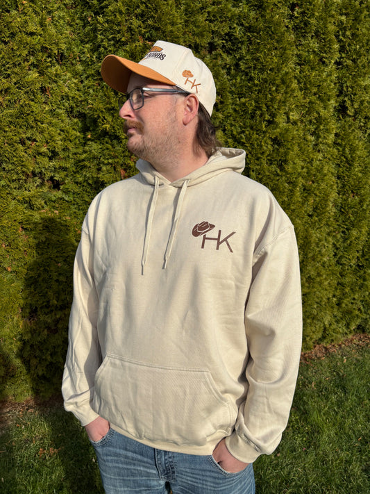 Men’s sand Broke Bronc hoodie with brown HK chest logo by Hides & Kinds