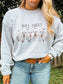 Close up of woman wearing the Bull Sheet Crewneck with cows in ghost costumes, hand in jeans pocket