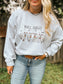 Woman smiling while wearing the Bull Sheet ash grey Halloween crewneck with cow ghost design