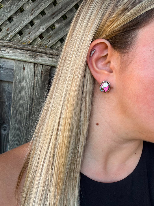 Close up of the Candy Quartz Studs featuring pink and green stones with silver rope detailing, worn on the ear.