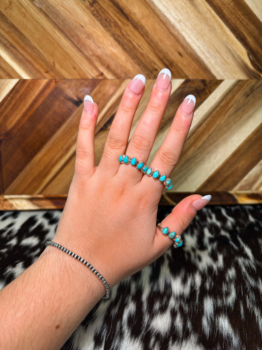 Hand wearing Claire authentic turquoise and sterling silver ring – western jewelry