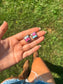 Cotton candy turquoise diamond stud earring worn on left ear with hair tied
