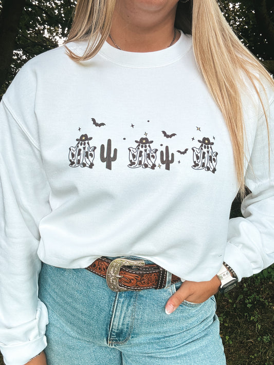 Close up of Cow Print Ghosts Crewneck featuring western ghost and cactus design.