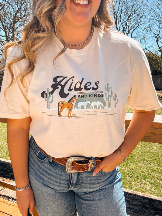 Woman wearing the Desert Horse Tee in natural, showcasing the western horse and cactus graphic up close