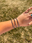 Western style double rope cuff bracelet close-up with detailed silver twist design