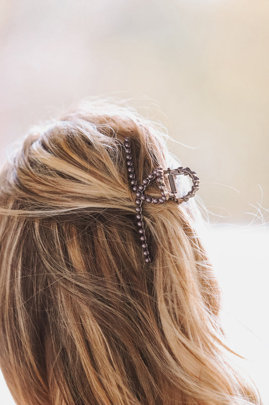 Model wearing Down South Pearl Claw Clip securing hair in western style – Hides & Kinds