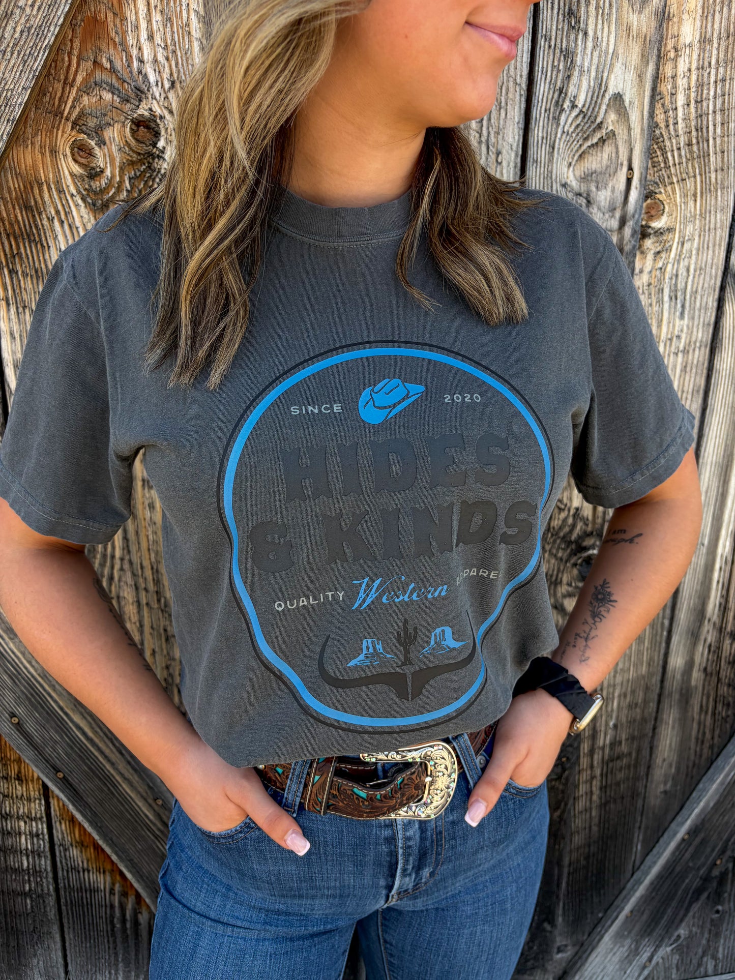 Dustland Tee in charcoal featuring western badge graphic design by Hides & Kinds