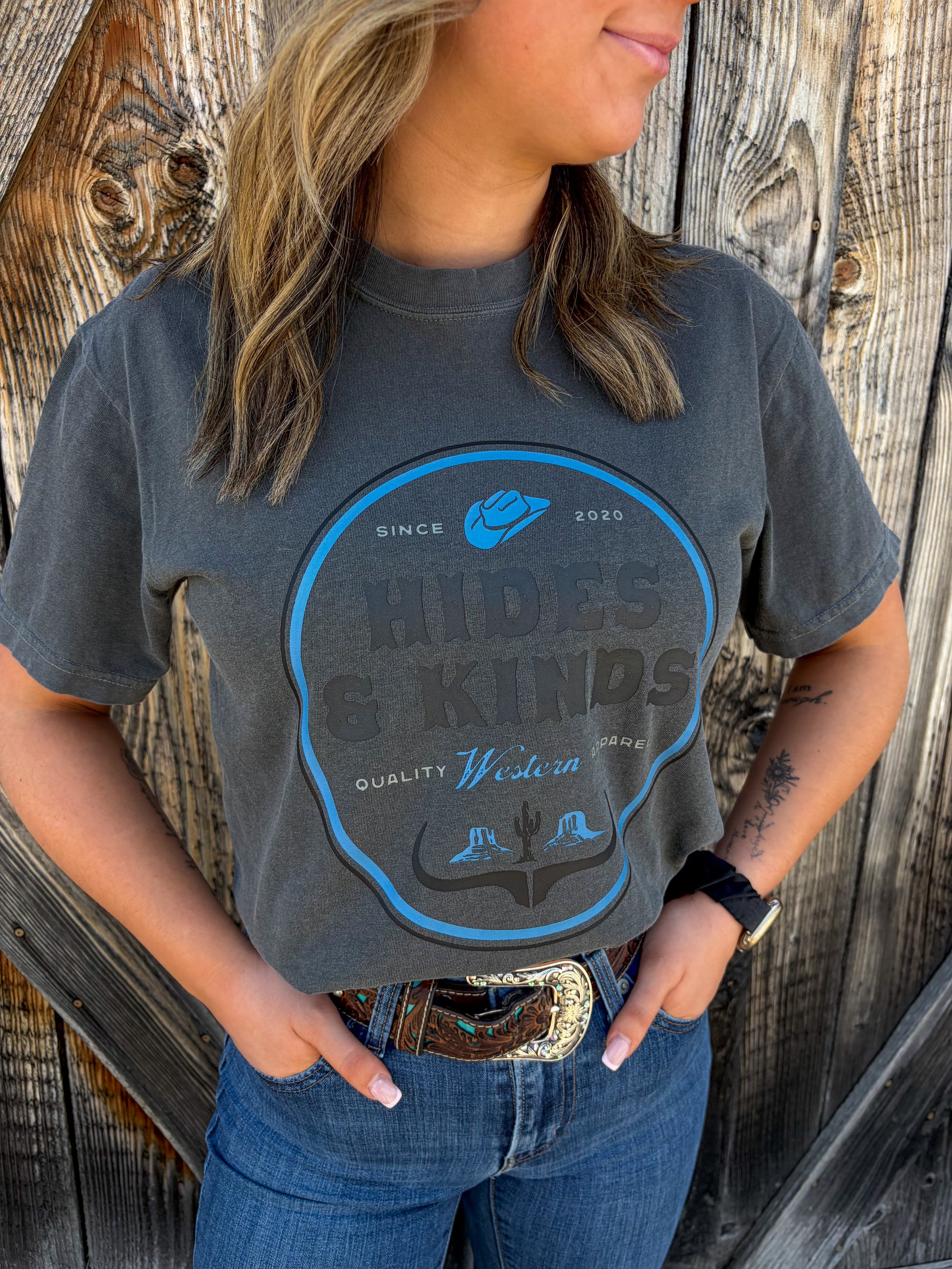 Dustland Tee in charcoal featuring western badge graphic design by Hides & Kinds