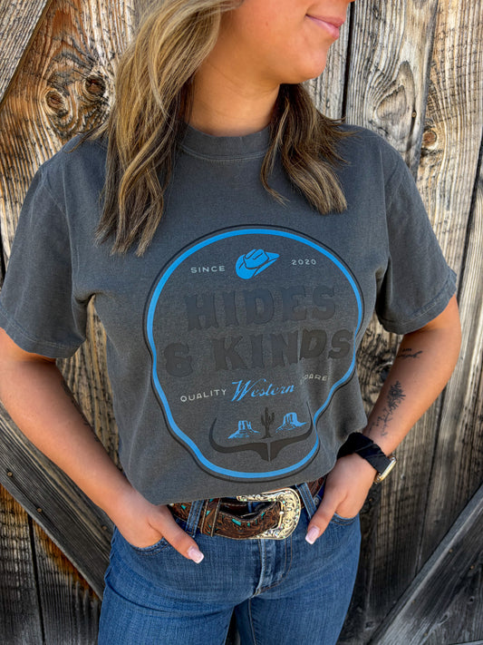 Dustland Tee in charcoal featuring western badge graphic design by Hides & Kinds