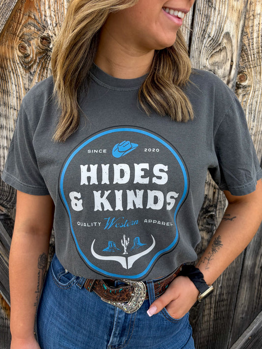Close up of Dustland Tee in pepper with white Hides & Kinds western graphic print