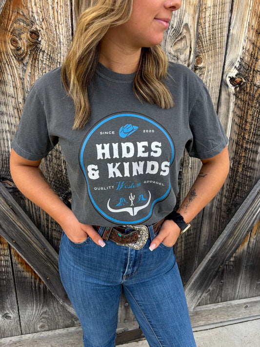 Model wearing Dustland Tee in pepper with white western graphic paired with denim jeans