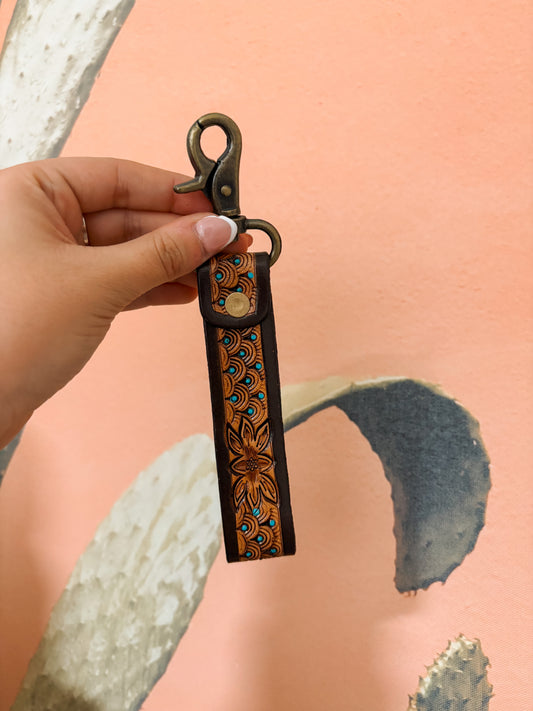 Frontier Tooled Wristlet with turquoise floral tooling and antique brass clasp – Hides & Kinds
