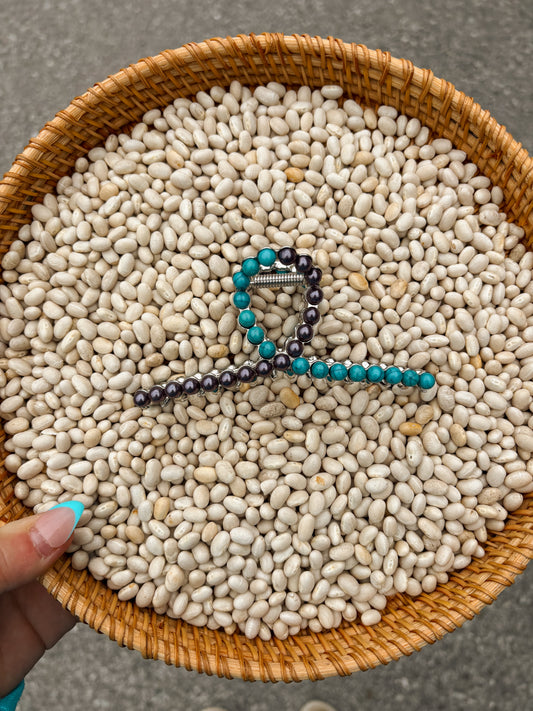 Half Pearl & Half Turquoise Claw Clip resting in woven bowl filled with white beans – western accessory