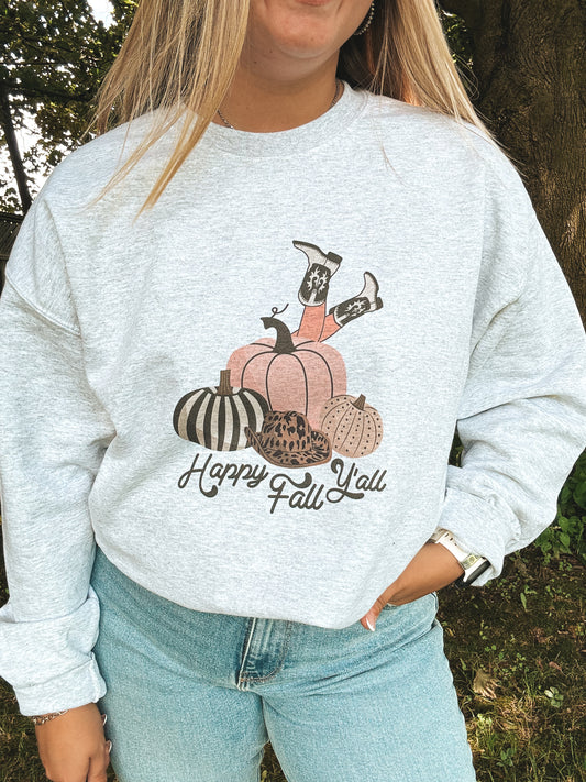 Close up of Happy Fall Y’all crewneck with pumpkin and cowgirl boot graphic, worn with light denim
