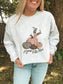 Detailed view of Happy Fall Y’all design featuring pumpkins, cowboy hat, and boots on light grey crewneck.