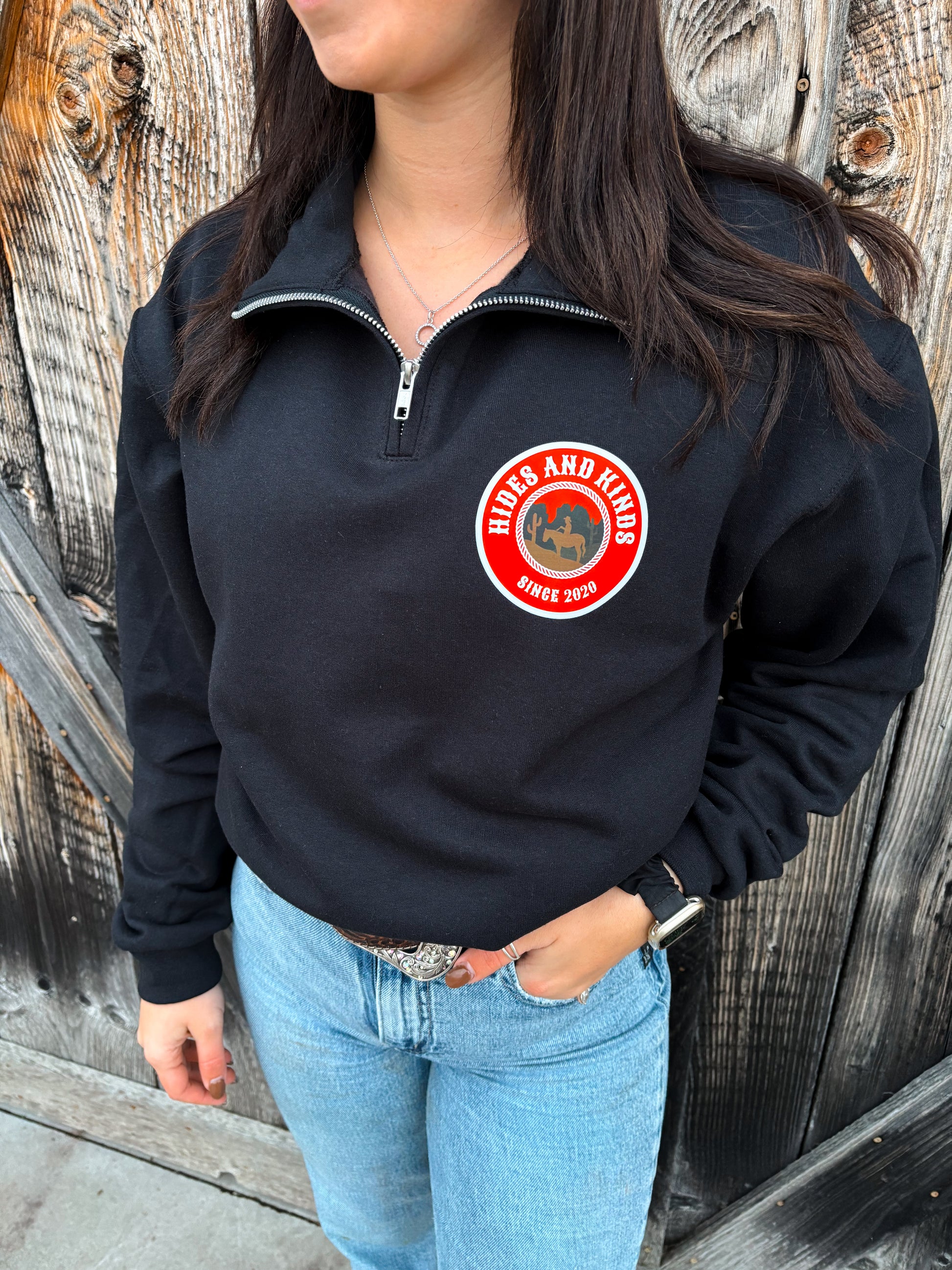 Front view of the Heritage Ranch Quarter Zip in black with the retro HK ranch badge logo.